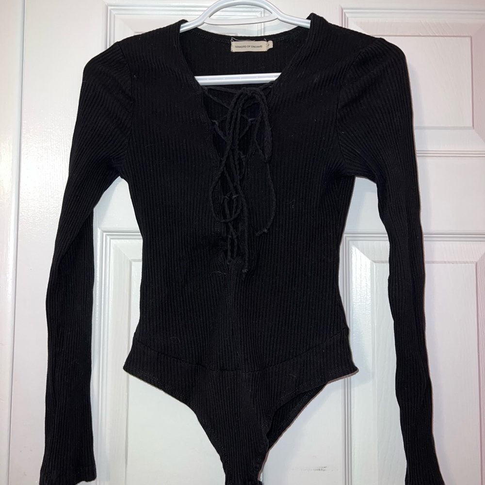Black long sleeve body suit with deep v-neck